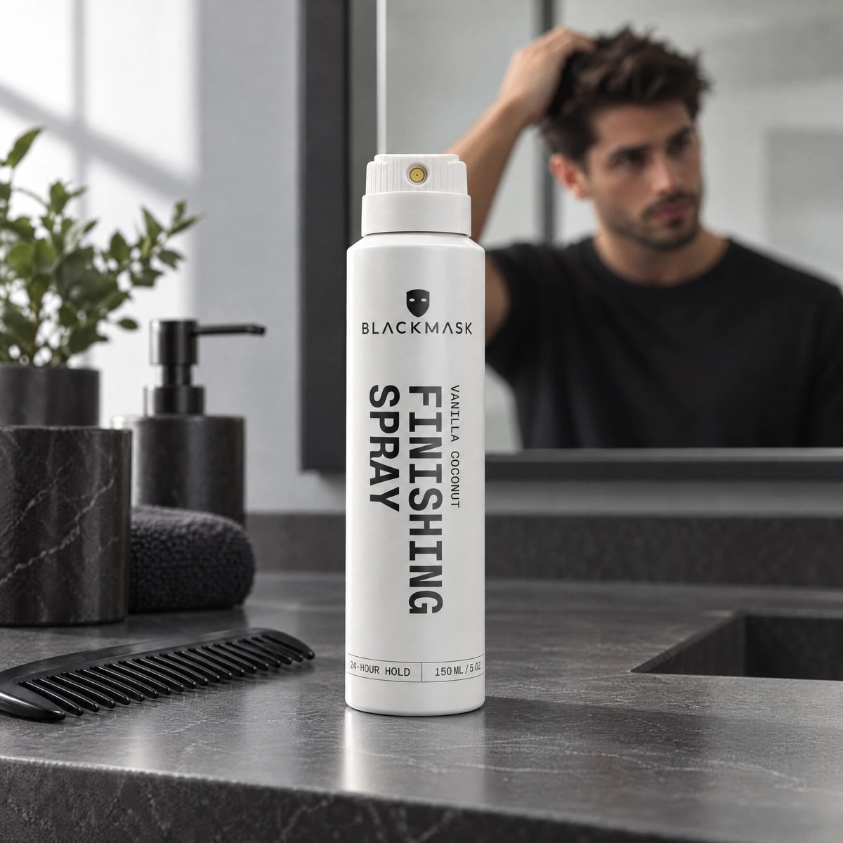 Finishing Spray on a graphite vanity beside a comb