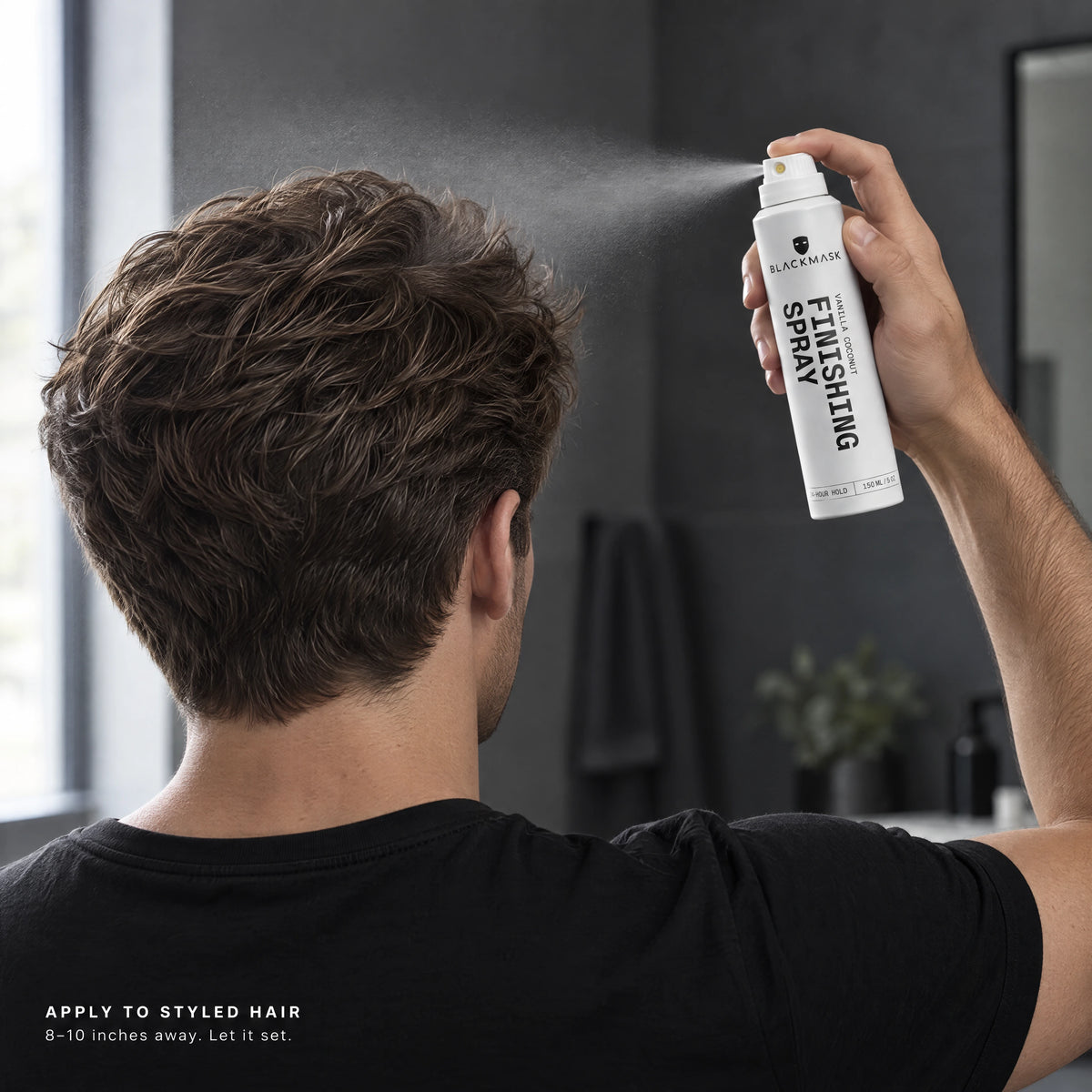 Applying Finishing Spray to styled hair from 8–10 inches away