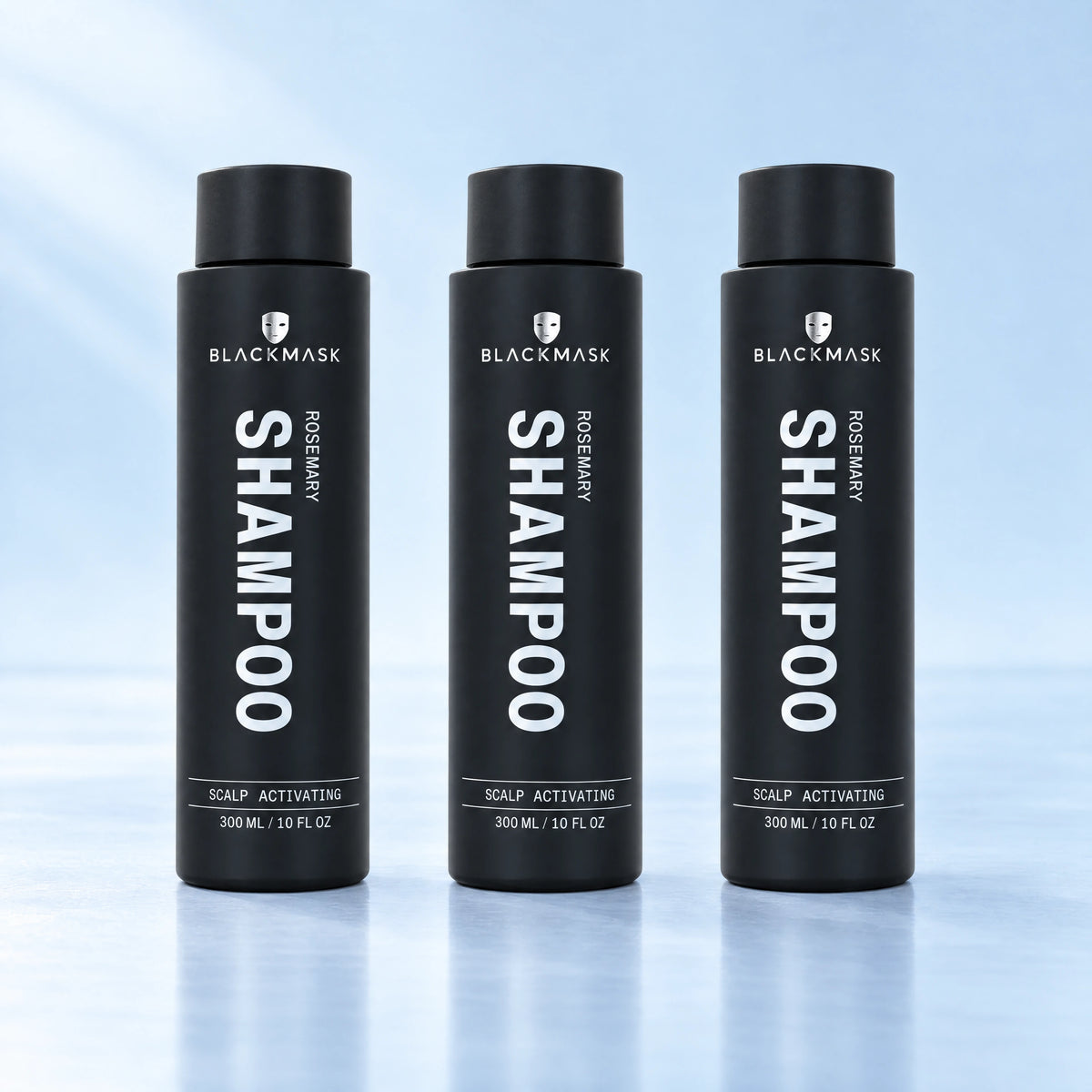 BLACKMASK shampoo three pack on a pale blue studio background