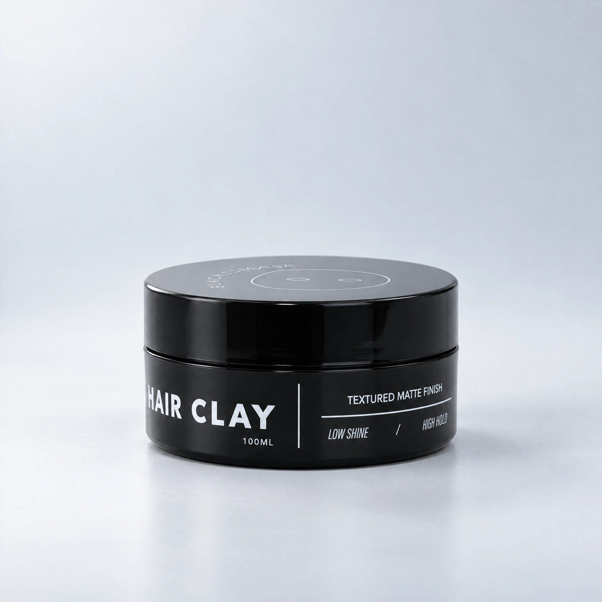 BLACKMASK Hair Clay jar on a cool grey studio background