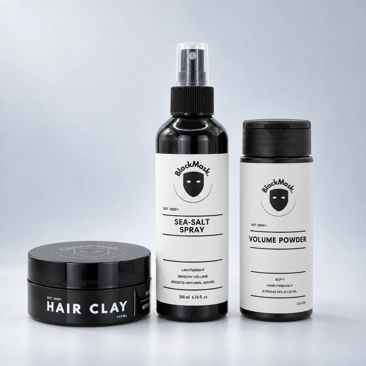 BLACKMASK Sea Salt Spray, Hair Clay and Volume Powder bundle on a cool grey studio background
