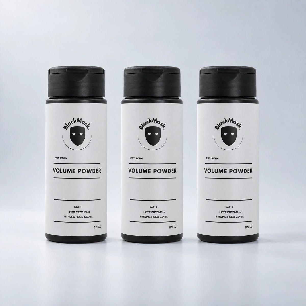 BLACKMASK Volume Powder three-pack on a cool grey studio background